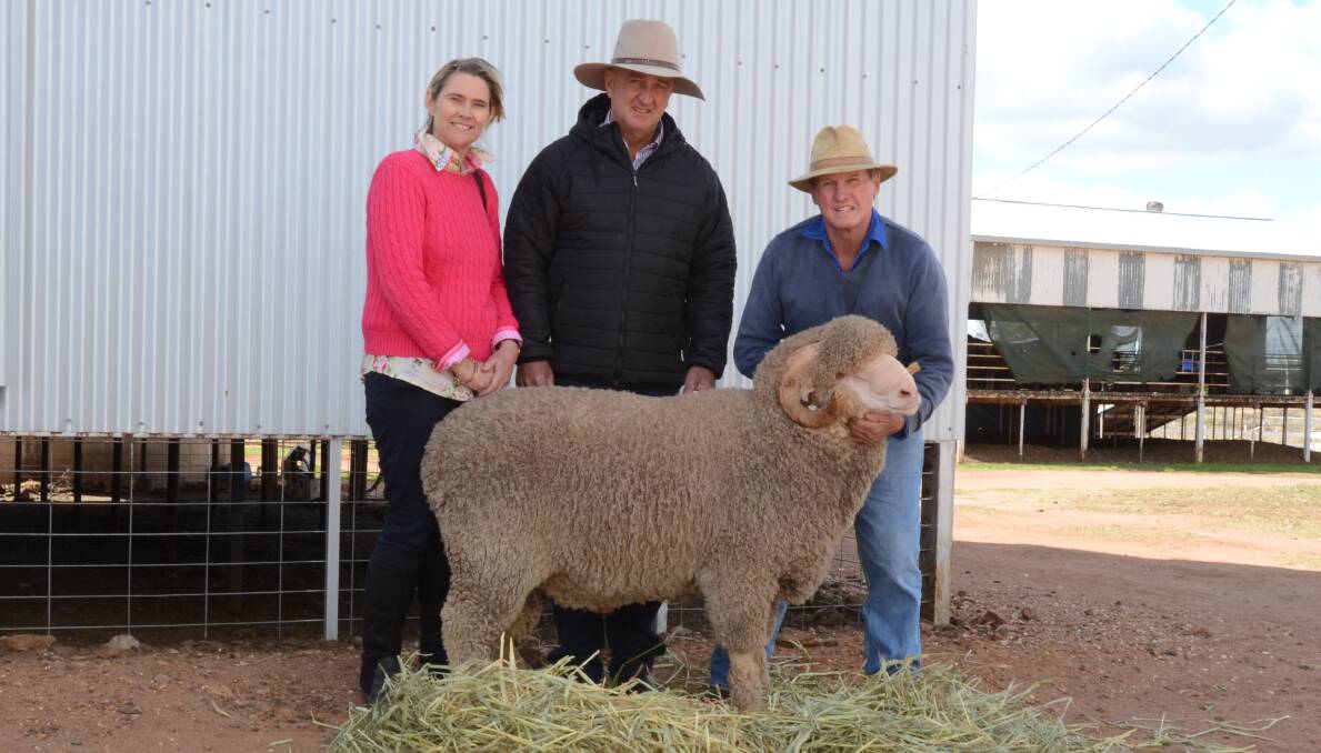 Annette and Les Amos, Burrenbah Merinos, Mungindi, saw this ram at the Dubbo National and attended the Darriwell sale to purchase it for $8800 top price. They are with stud co-principal Russell Jones holding the ram.