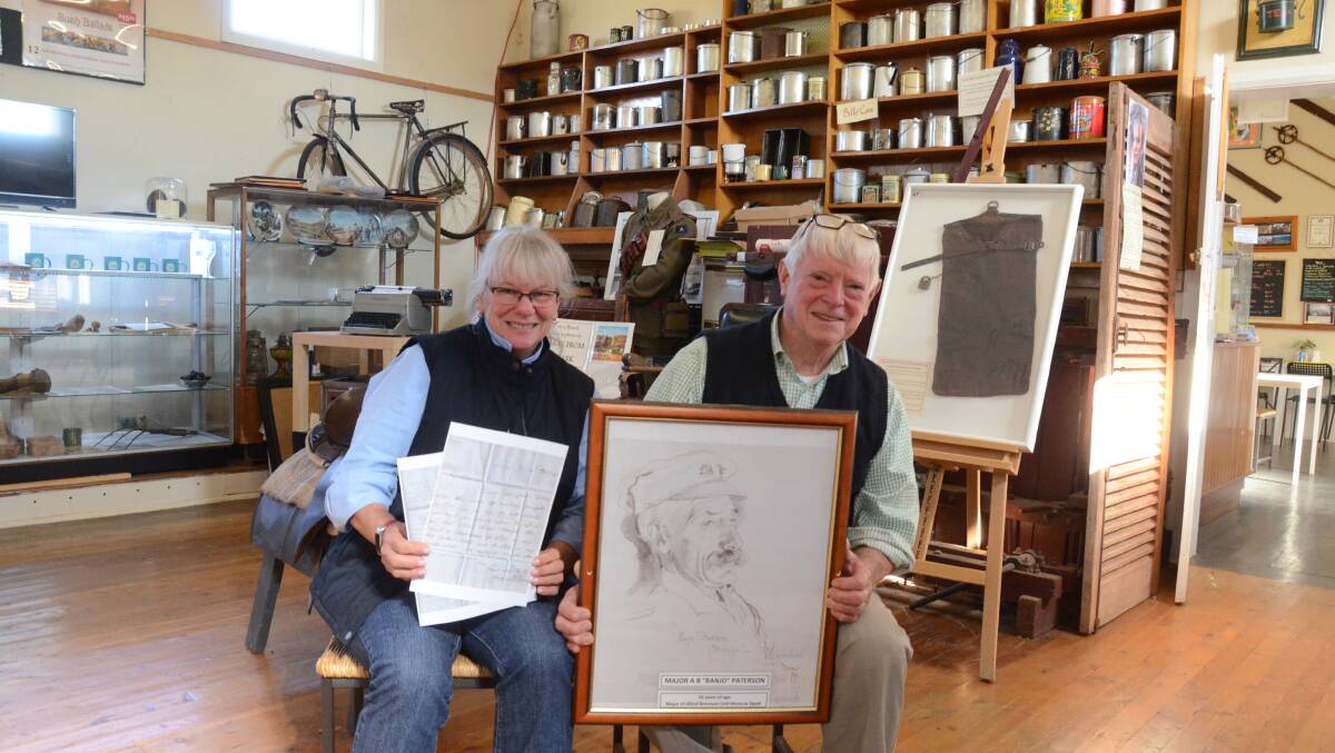 Sharon and Alf Cantrell hold letters and portrait of Banjo Paterson when Major in Egypt drawn by War Artist George W Lambert.