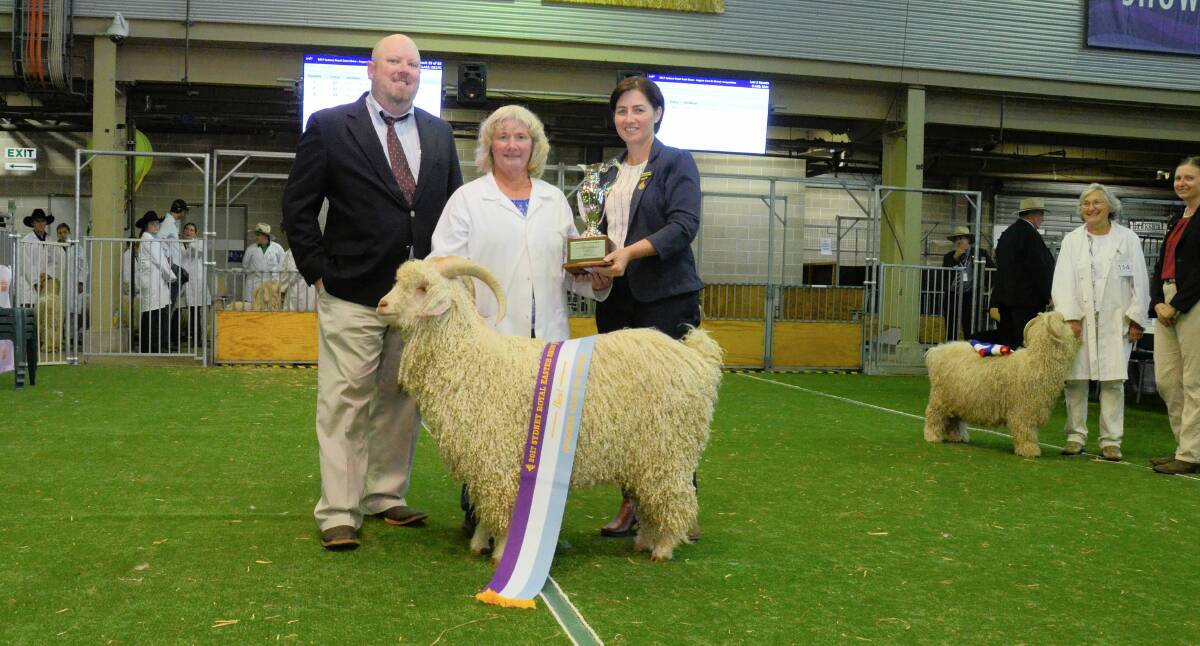 Best Angora exhibit was the junior champion buck and junior grand champion, Cullbookie Geronimo. Pictured is the judge, Fred L Speck Junior, Speck Angoras, Kerrville, Texas, USA, with exhibitor Debbie Scattergood, Cullbookie stud, Bungendore, and steward in chief, Kate Wickson, resents the trophy.