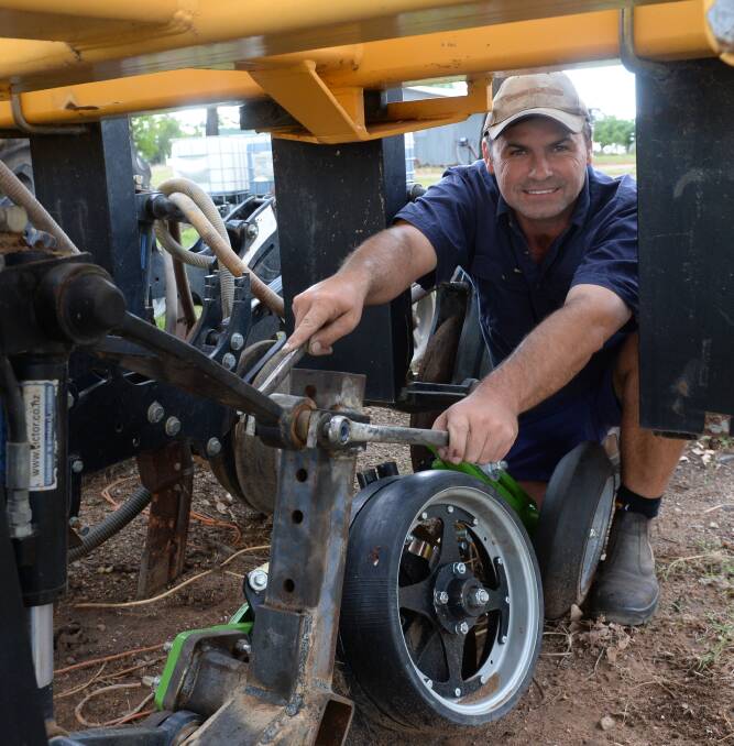 Jason Denniss tightens bolts on one of the Boss single disc units he is attaching to a 12 metre Bio-Drill planter at Bobbiwaa Pastoral, north of Narrabri, while getting ready for winter sowing on 2430 hectares in the next week or two.