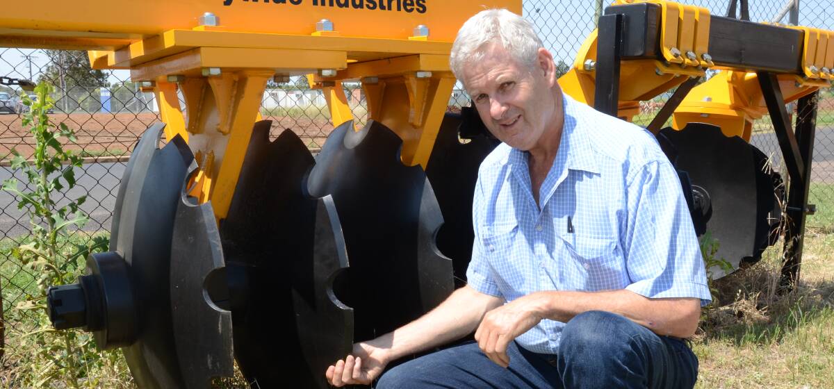 Countrywide Industries principal Rodney Carr shows the disc units that attach to the 10-6HD Tandem Plough at his Dubbo manufacturing centre.