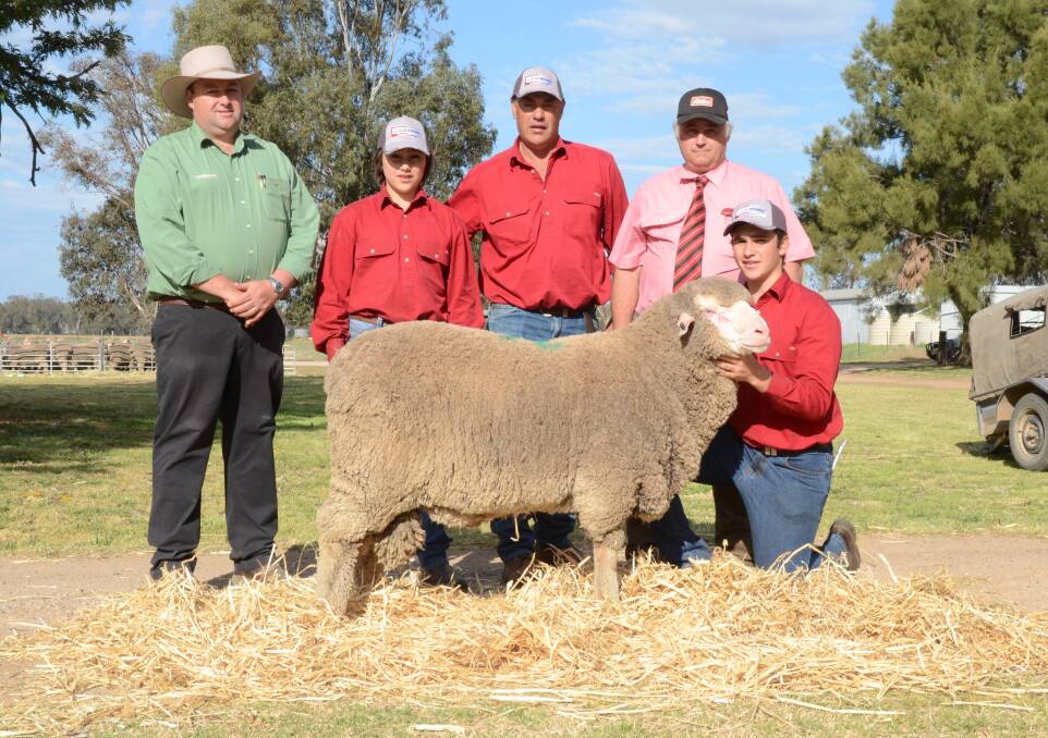 Brad Wilosn, Landmark, Dubbo; Campbell and Glen Rubie of Lachlan stud; Scott Thrift, Elders, Dubbo, who purchased the $10,000 top-priced ram for the Bowden family, Bothwell, Tasmania; and Mitch Rubie holding the ram.