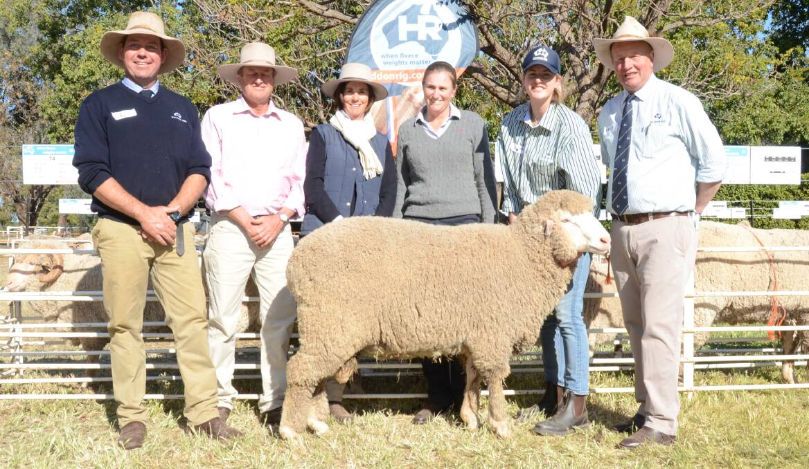 Top $5500 Poll Merino ram with HR manager Andy Maclean; buyers Reg, Robyn and Rowena Sweeney, "Pinehurst", Merrygoen; Olivia and George Falkiner.
