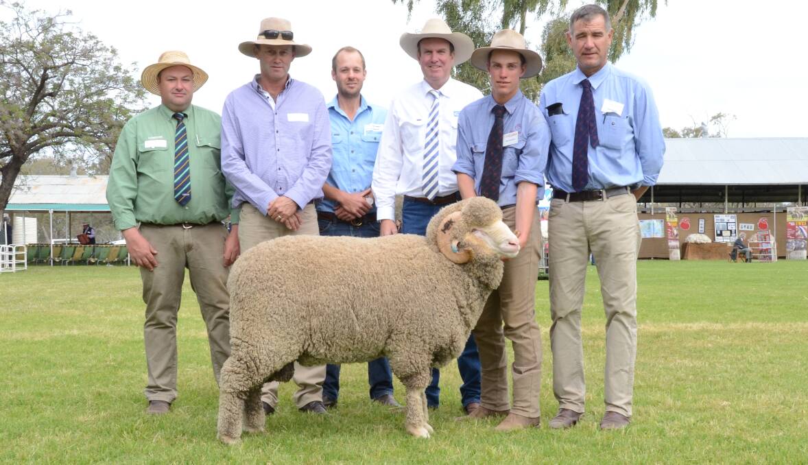 With the $16,000 sale topper:- Brad Wilson, Landmark, Dubbo; buyers Dave Motley, Gerar Station, Nyngan, and Campbell Keene, "Yoorooga", Yeoval; Paul; Dooley, auctioneer; Tom Cameron and Egelabra manager, Cam Munro.