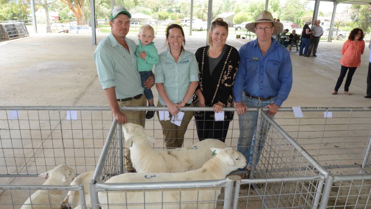 Meriden Australian White stud principals Josh and Monique Pointon and son, Jack (2 years), Oberon, with Lauren and Ryan Bywater, “The Hill”, Koorawatha, buyers of the two $1550 top-priced Meriden rams after the combined Binda and Meriden flock ram sale at Mudgee.
