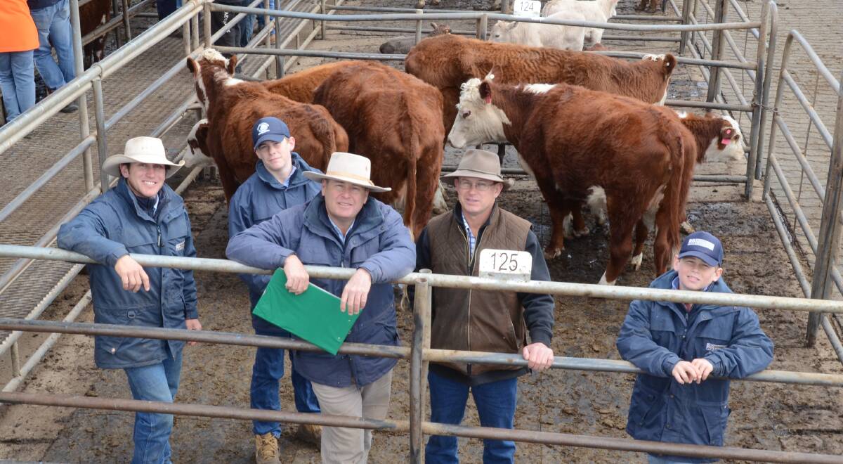 Richardson and Sinclair's team of Justin Sanderson, Warren, and Scott Sinclair, Dubbo, with his sons Lachlan and Joe with buyer Chris Schmidt of CSLivestock, Mudgee.