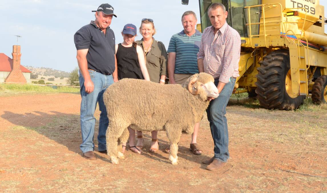 Doherty families Mark, Erin, Annette, and Peter, Klondyke Partnership, Goolma, with their $6500 top-price ram held by Allendale stud principal, Tony Inder, Wellington.
