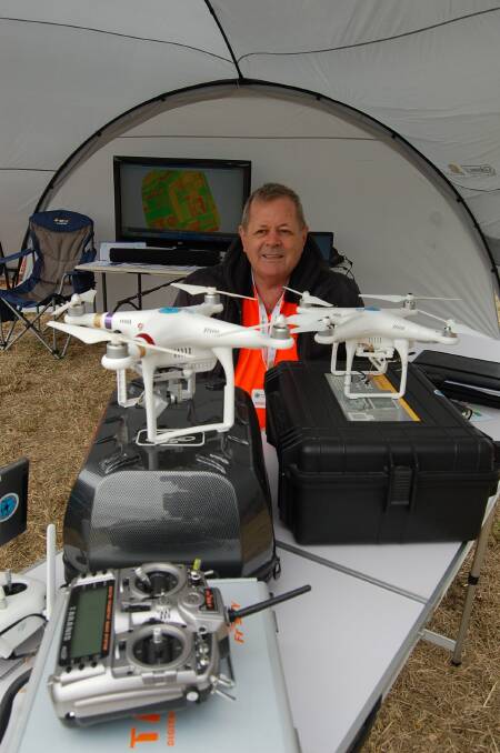 FLY READY: Qld Drone Photography chief pilot and CEO Tony Gilbert with his tools of the trade, ready to address farmers' growing interest in drone technology, at the National Horticultural and Innovation Expo. 