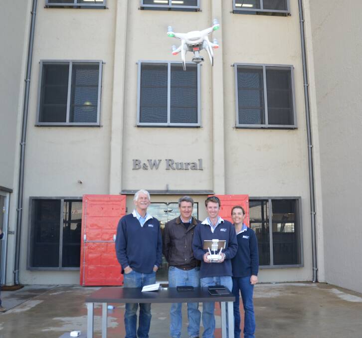 B&W Rural agronomists Peter Birch, Rob Long, Bradley Donald and Sophie O'Neill flying a Quadcopter drone at the agronomy business' head office. 