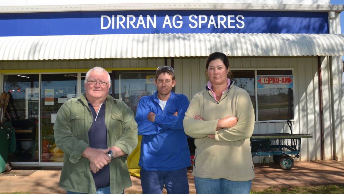 Dirran Ag Spares employees Trevor Brown, Janco Swanepoel and Peta Timmins fear further water recovery in Dirranbandi, Queensland, will hurt the supplies store's trade. 