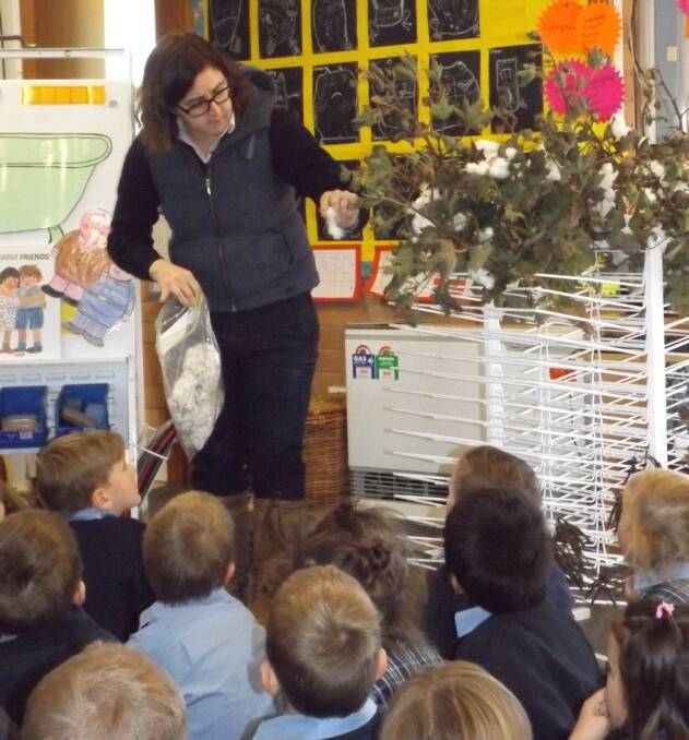 SCHOOL'S IN: Katrina Swift discusses cotton with the Parkes Public School Kindergarten classes.