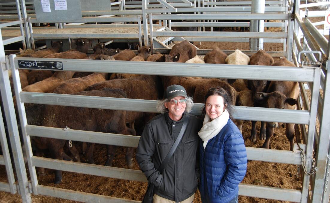 David Wynn and Leanne White, 'Havilah', Lidster, with the pen of 25 Murray Grey 8-9 month old steers they bought for $855 a head at the monthly Carcoar store sale. 