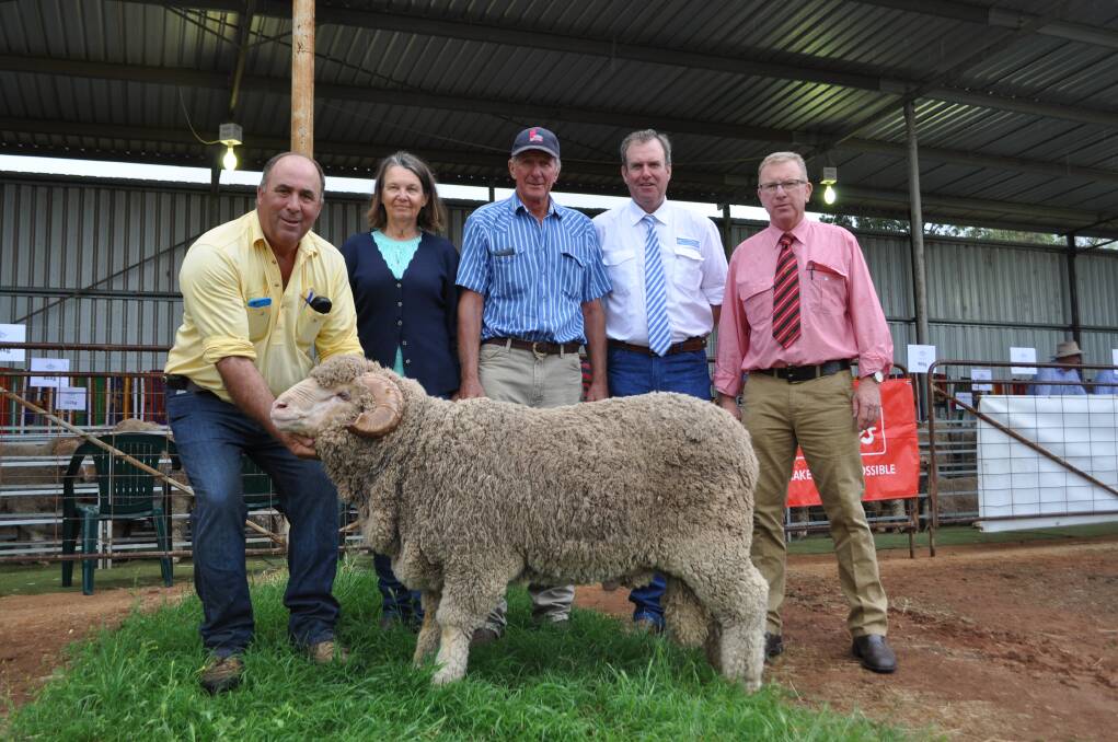 Stud principal Peter Capel, with buyers Philip and Coral Marshall, "Tareela," Burren Junction, auctioneer Paul Dooley and John Newsome of Elders Stud Stock with the top priced ram which sold for $7500. 