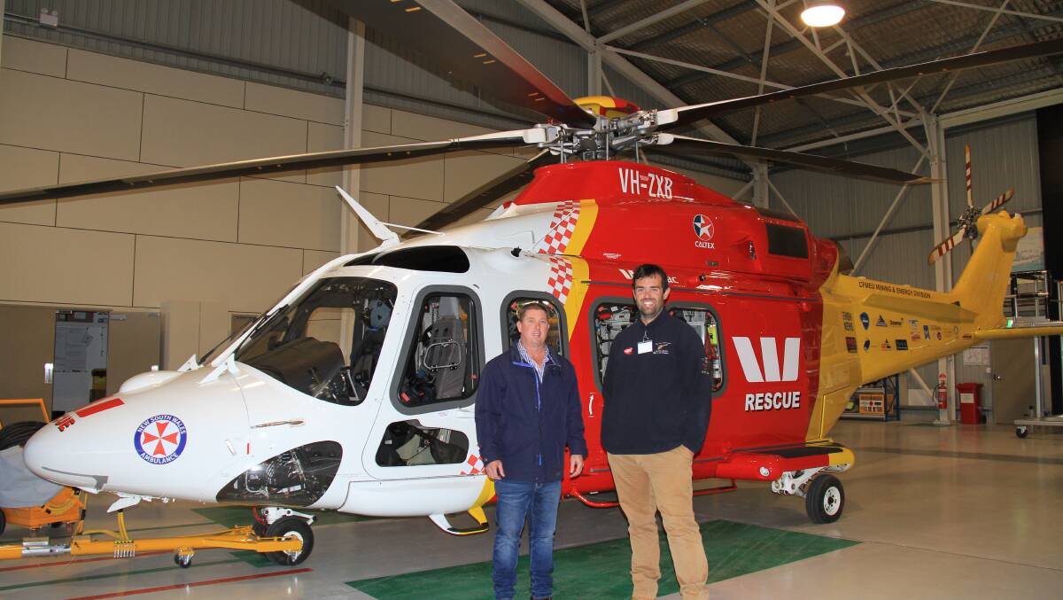 Santa Gertrudis Breeder's Association general manager, Stephen Ware, with Westpac Rescue Helicopter Service community liaison officer, Michael Wilson, Tamworth.