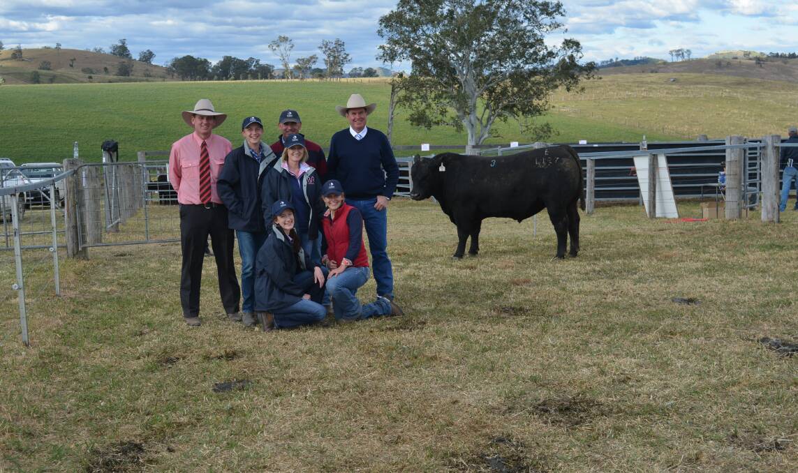 SALE TOPPER: Nick Hall, Elders, top bull buyers, Tim and Margaret Vincent and children, Amy and Hayden, Georgia Laurie, Knowla Livestock, and auctioneer, Paul Dooley.
  