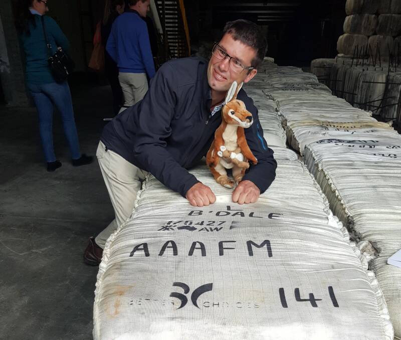 Cudal woolgrower, Floyd Legge, with a bale of wool from his family's farm which was the first thing he saw when he walked into a Chinese woollen mill during a recent study tour. 