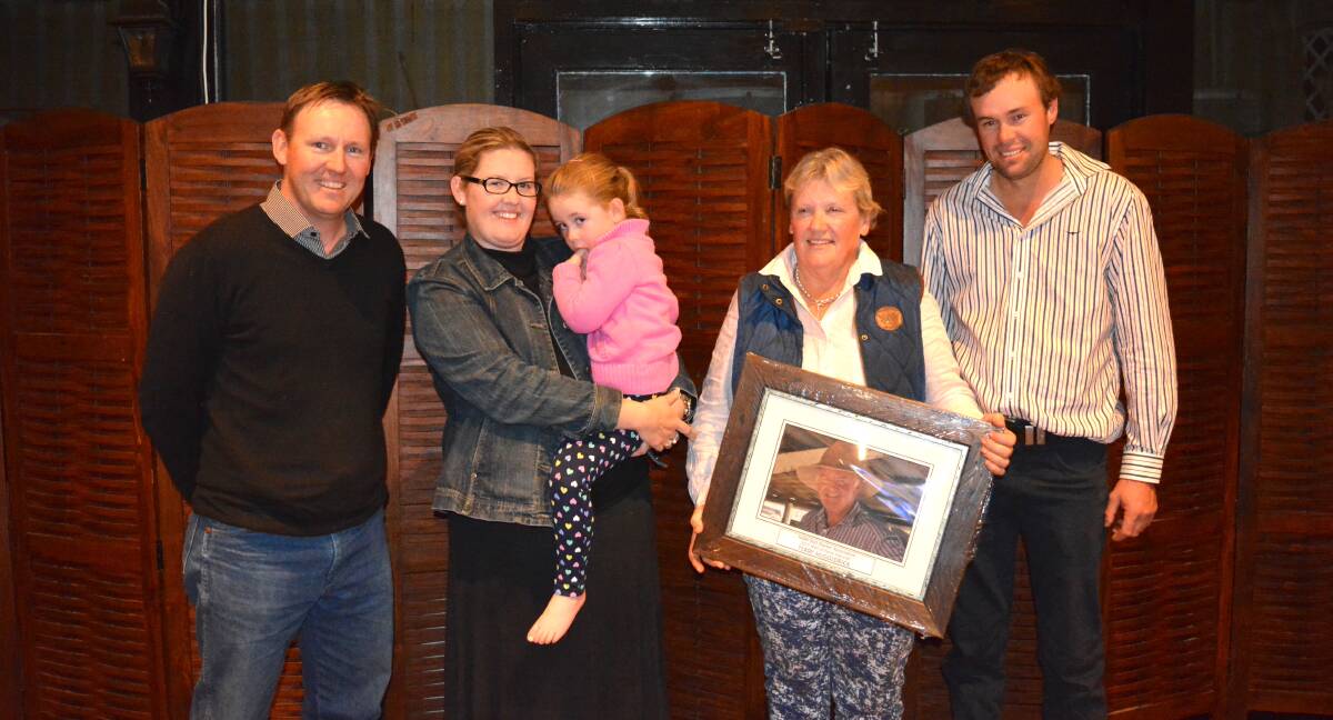 Marshall Douglas, Abelene Park Poll Dorsets, Woolomin, Melissa Wright and daughter Charlie, Sue McGoldrick and Lock Wright, all of Bimbadeen Park, Coonabarabran, with a photo of the late Terry McGoldrick who was inducted into the Wall of Fame at the Dorset dinner. 