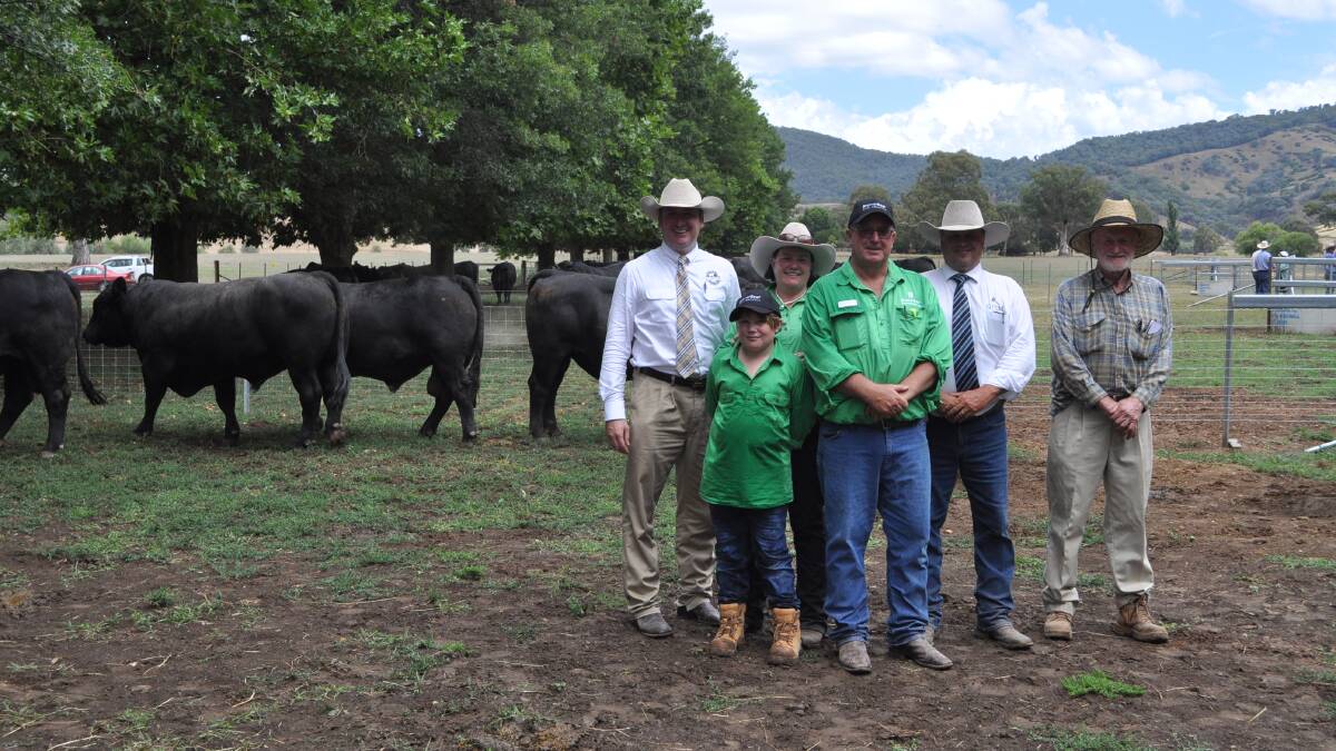 Elite Livestock Auctions’ Chris Norris and Glassers Total Sales Management’s Michael Glasser flank vendors Austin, Tara, and David Brewer, with purchaser of top-price bull Stewart Macoun, “Boongala”, Peak Hill.