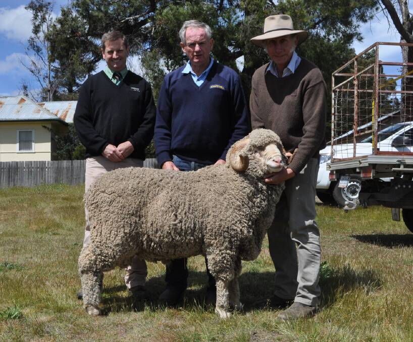 Landmark auctioneer Rick Power with Michael McCormack, Schute Bell, who purchased the $4000 second-highest price Boudjah ram on behalf of Ron Hardy, Sutton, and Boudjah principal, Michael Green.