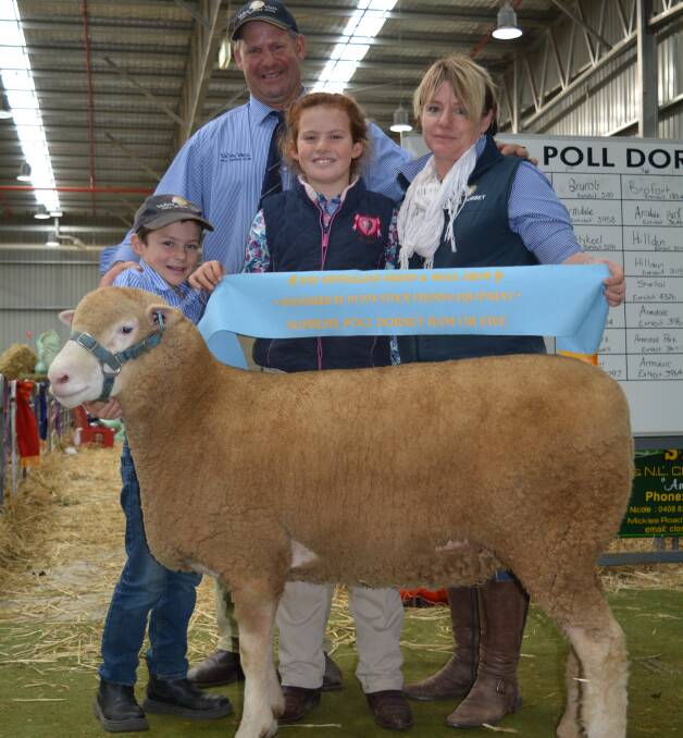 Supreme Poll Dorset exhibit won by the Scott family, Valley Vista stud, Coolac. Pictured is Andrew and Donna Scott with their children Zac and Sally and supreme exhibit. 