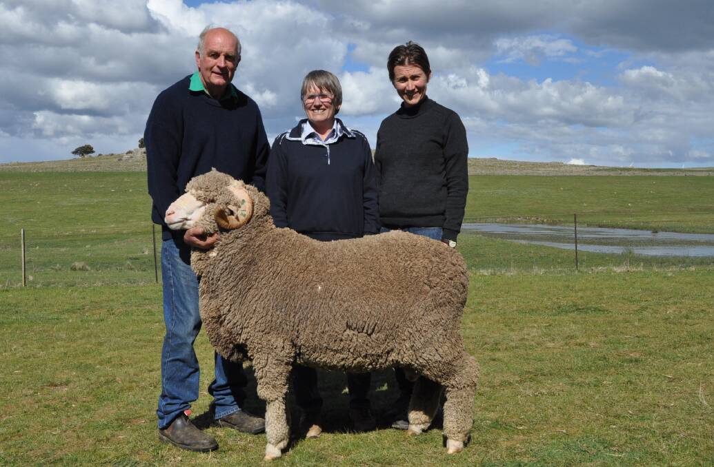 John Alcock holds the top $2800 ram which sold to long-term clients Allison Burston and Jill Hill, Benambra.