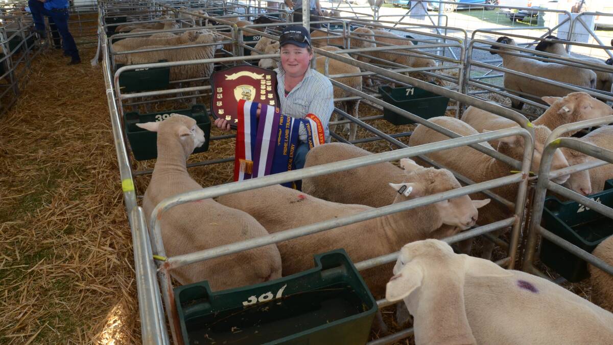 Josh O’Connor, “Lynwood”, Eumungerie, with his grand champion hoof and hook pen of lambs and holds the Paul Sinclair Memorial trophy. The lambs were champion on the hoof and champion local entry and trade weight hoof class winner.