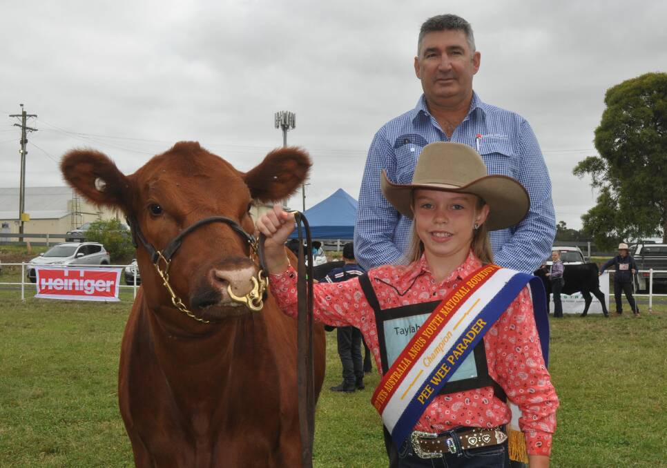 YOUNG GUN: Southern Australian Livestock general manager Laryn Gogel with champion pee wee parader Taylah Hobbs, Orange.