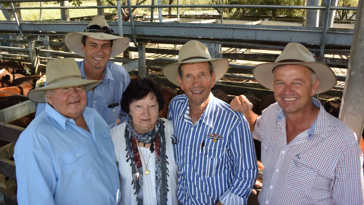 John Smith, Woodenbong; Michael MacCue, 'Wilga' Bellata; Maree Smith, Woodenbong; Arch Northam, George and Furhmann, Casino  and Bob Jamieson, Inverell blocking our view of the champion pen of Santa cross weaners that sold to 382 cents/kg for $1407.