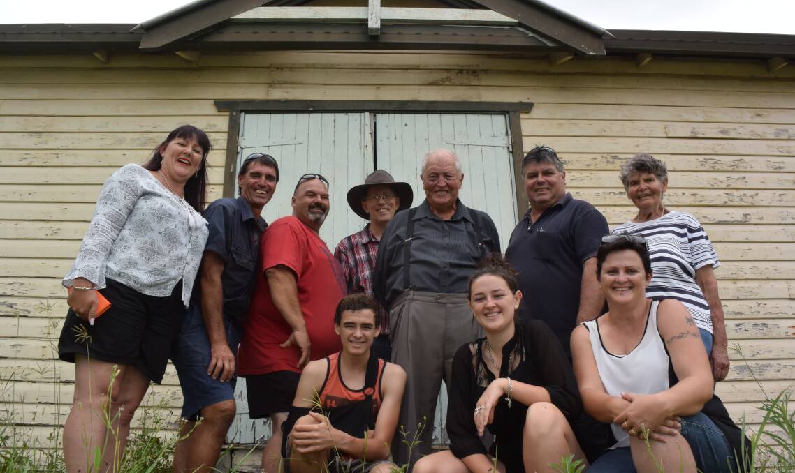 Communities in the Kyogle Shire are fighting to unlock the potential of their local community halls, like this one at Cedar Point. Tony Zammit, in red, is leading the charge to save this and Horseshoe Creek halls from destruction.