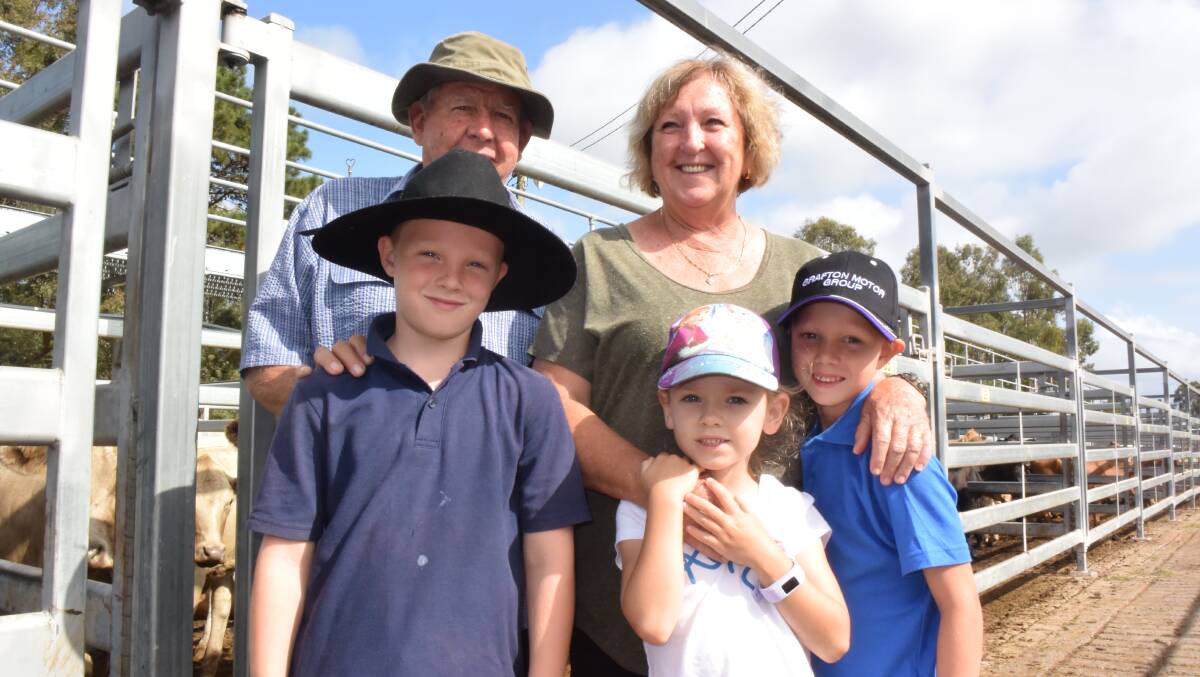 Rod and Val Bursel, Carangi, with their grandchildren Ethan, Mia and Flynn at the Grafton store sale on Thursday, where Rod bought A pen of Charolais weaners, 228kg, for 240c/kg or $549 and another of Angus, 181kg, for 266c/kg or $483. 