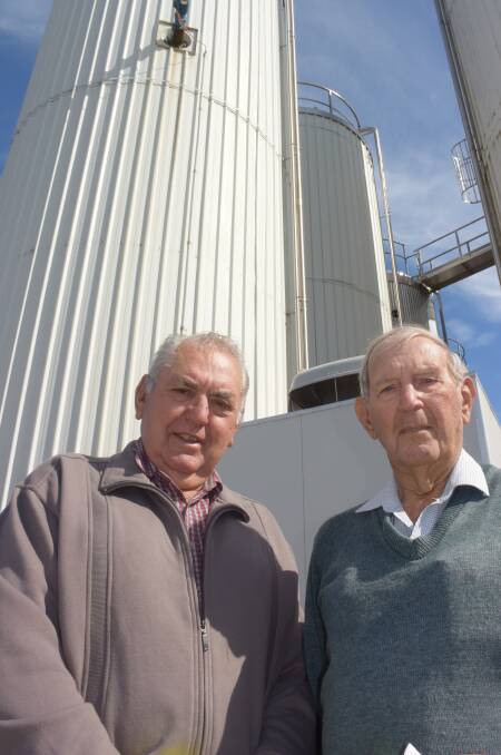 Former Casino Dairy Co-operative employees Martin Maloney and Ian Robinson outside Richmond Dairies' milk silos, which now occupies the old co-op premises.