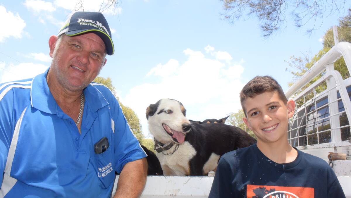 Coramba commission buyer Eleizer Robinson is introducing his son Flynn, 11, to the art of landing a bid during these school holidays. They were pictured at Grafton store sale.