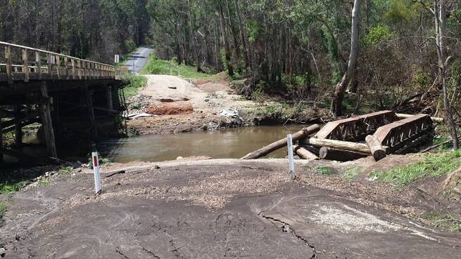 Clouds creek bridge on the Armidale Road to Grafton was damaged by bushfire and its temporary replacement washed away. Permanent repairs are months away.