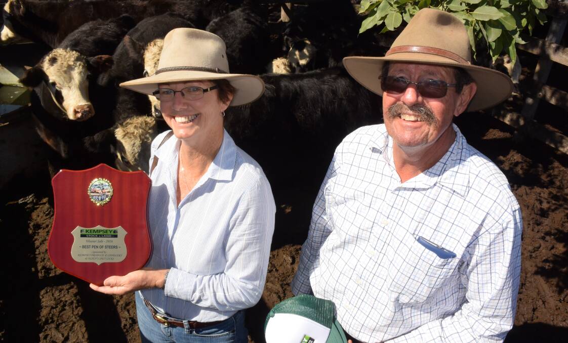 Gail and Barry Lee, Sherwood via Kempsey, with their pen of champion weaner steers at last Friday's Kempsey sale.
