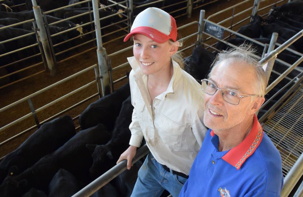 Ellnyie and her father Hector Cameron sold Angus steers by Farrah bulls off property at Uralla for 320c/kg to 338c/kg topping at $933, during Friday's Armidale weaner sale.