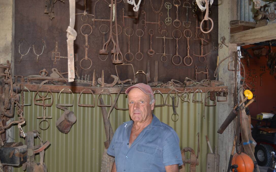 Trevor Hussey displays his collection of bridle bits among the various other items associated with running pastoral properties in bygone years. 