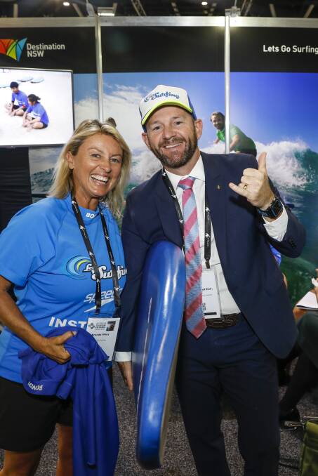 Let's Go Surfing founder Brenda Miley with NSW Minister for Trade Niall Blair at the Australian Tourism Exchange in Sydney this week. The expo was designed to put regional tourism operators in the shop window.  