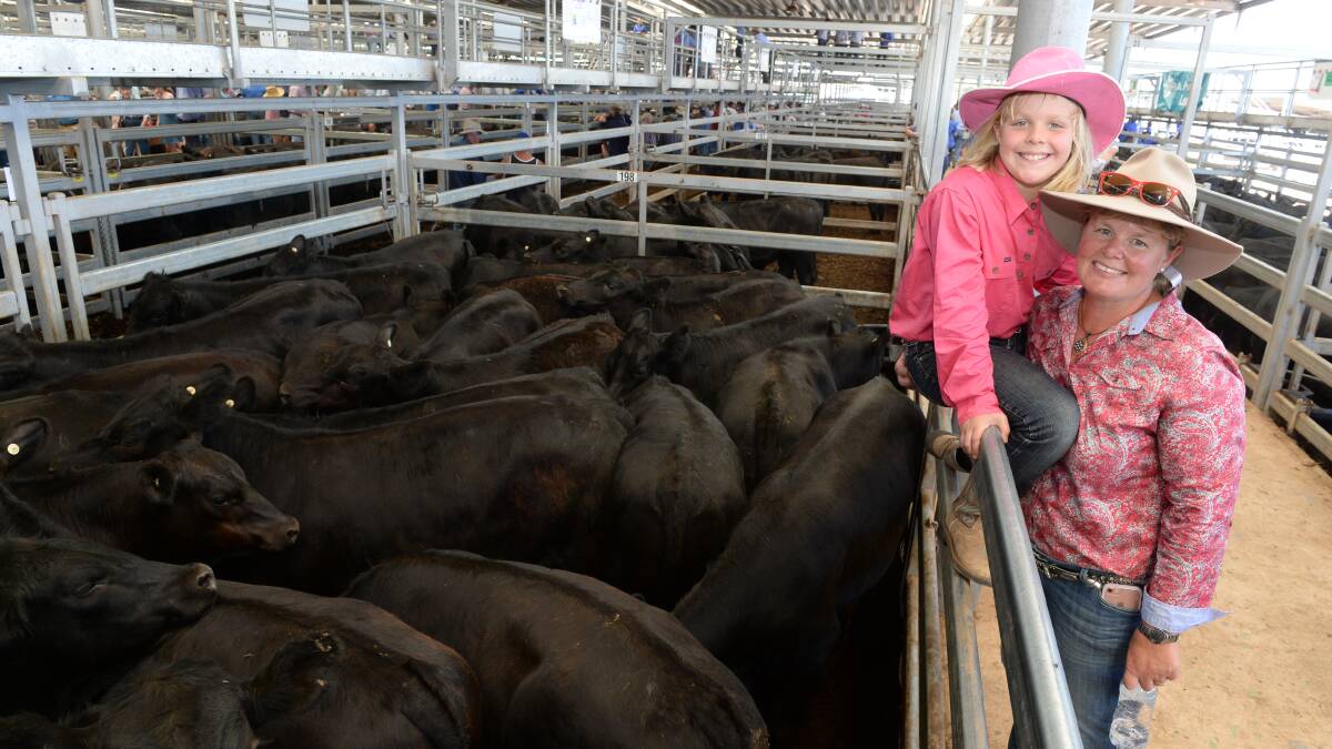 Kate Parry and daughter, Sarah, 'Glengarry', Sandigo via Narrandera with one of their three pens of young Angus cattle at the first sale at NVLX for 2017. Much of the property was under water for months due to flooding in 2016 with limited pasture available for the young cattle.