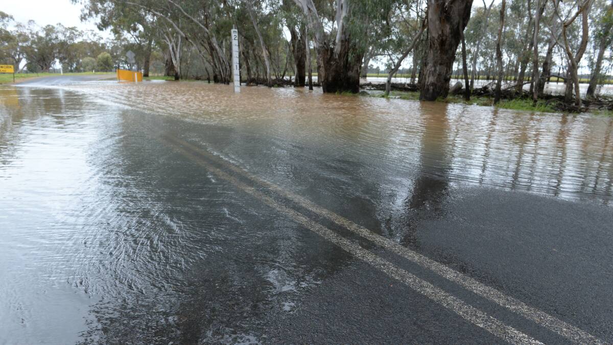 Rain eases, but flood warnings remain in place