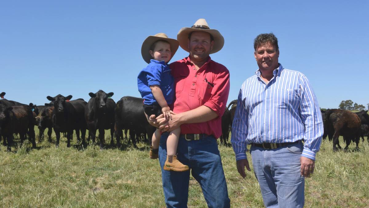 Farm manager Ben Cumming, his son Jack, 3, and owner John Bergamin with some of the Angus cattle at “Nanjomara”, Willow Grove, in Gippsland, Victoria.