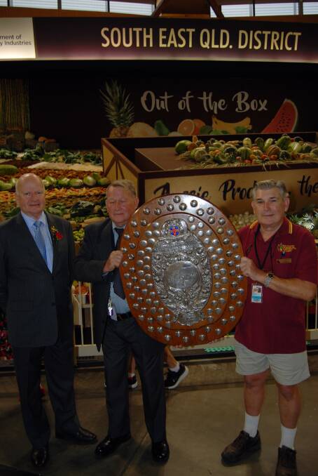 Royal Agricultural Society of NSW president Robert Ryan with Col Dabelstein, Glasshouse Mountains, Qld, his brother, Lester, Brisbane, and the winners' trophy.