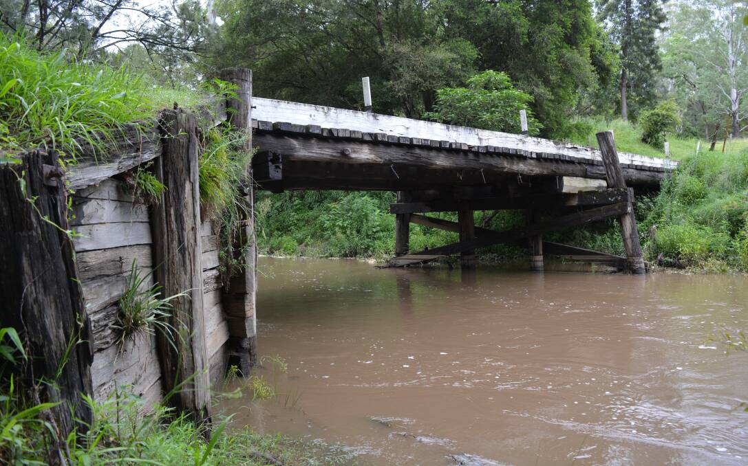 North Coast producers like Earl and Marilyn Grundy say the region's decrepit timber bridges, pictured here, are hurting their hip-pocket.
