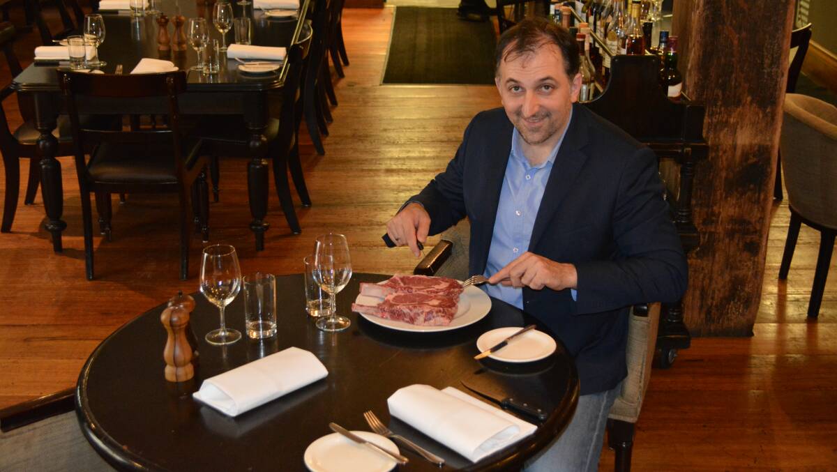 Owner George Vardis believes his CAAB MSA 650-gram 150-day grain-fed Angus rib on the bone steak is good enough to eat raw at Kingsley’s Steakhouse, Sydney.