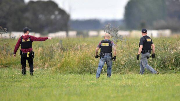 Border Force officers go after potential illegal workers. Photo: Joe Armao