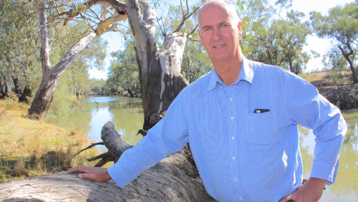 Chris Jones looks over the backed-up Lachlan River from the “Everton” property he bought in 2003 to provide frontage for adjoining “Brotherony”. 