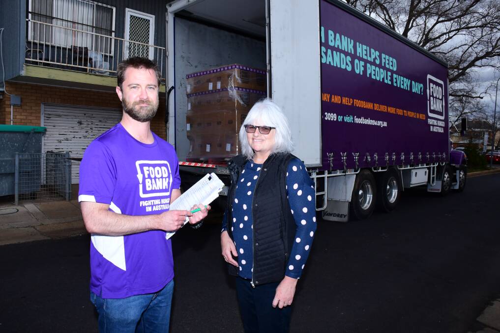Welcome donation: Adam Loftus from Food Bank NSW/ACT with Geraldine Tosh Manager Emmanuel Care Dubbo. Photo: Belinda Soole. 
