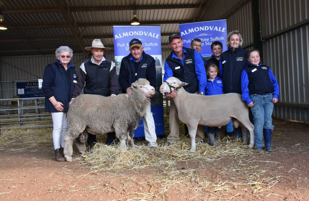 Purchaser of both top price Poll rams Laurie Beer, "Woodbury", Deniliquin; flanked by Marita and Peter Routley; while top price White Suffolk buyer Bill Darmody, "Wantana", Booroowa; is with Paul, Ruby, Lachlan, Dallas, and Grace Routley.