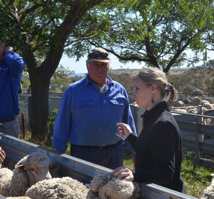 Merino producer Tony Armour with daughter Kellie at the Bookham Flock Ewe Competition. Mr Armour suggested studmasters or auctioneers should explain what rams had been fed during the year, prior to a sale. Photo: Stephen Burns