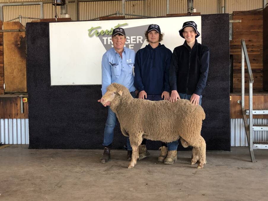Trigger Vale stud principal Andrew Bouffler, Jamieson Bouffler, Tom Norman (currently on placement at the stud from Charles Sturt University) and the top-priced ram, which sold for $10,200. 