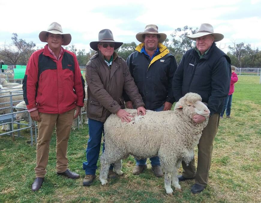 The top priced ram with Cameron Townsend, Elders Griffith, Geoff Peters, Ballatherie, Paul Mulcahy, Merrowie Manager Hillston and Stephen Chalmers, Ballatherie Classer and Landmark Merino Stud Stock Specialist. Photo supplied.